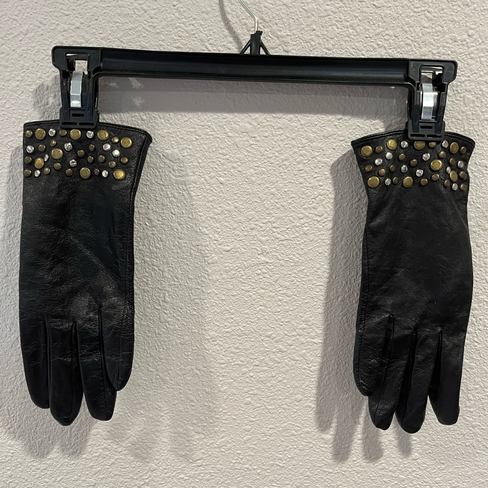 Black leather gloves. With metal detail at wrist